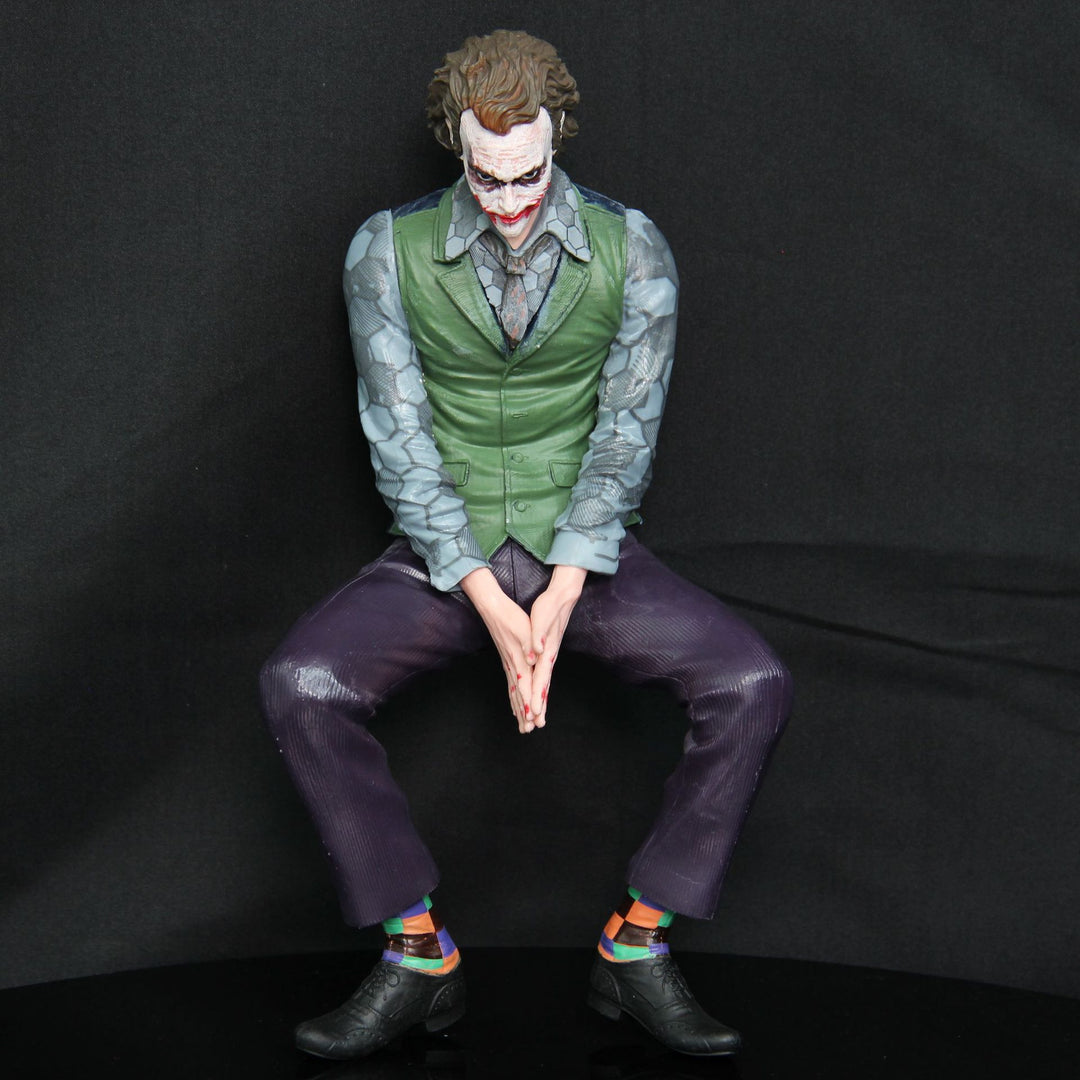 Joker Heath Ledger sitting doll