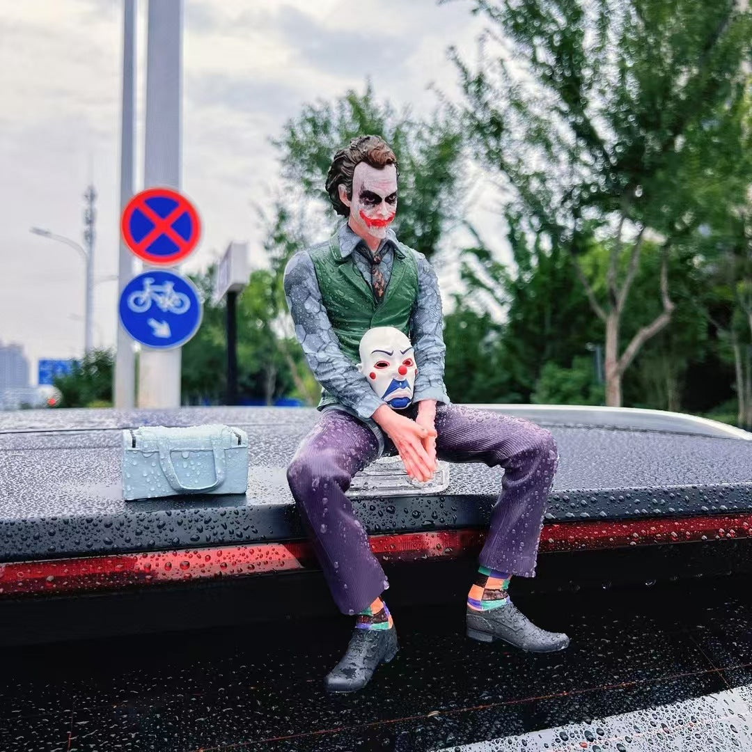 Joker Heath Ledger sitting doll